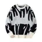 Light grey crewneck jumper with bold black graffiti print and contrasting cream ribbed cuffs and hem