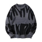 Slate grey knitted jumper featuring an abstract black graphic pattern, relaxed oversized fit shown flat