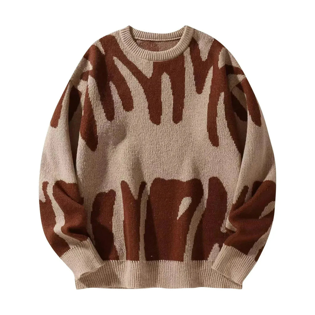 Beige knit jumper with rust brown abstract graffiti design, ribbed crewneck collar and cuffs visible