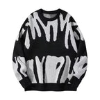 Black crewneck jumper with large off-white graffiti-style print covering the front and sleeves