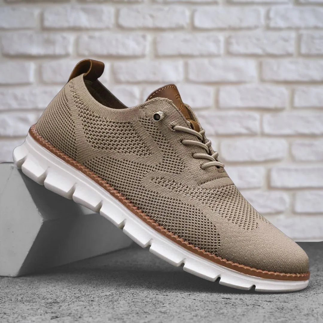Side view of a khaki knit trainer with tan leather heel tab and chunky white lugged sole