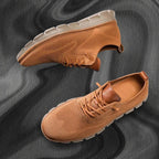 Tan knit trainer with matching tan leather heel tab and cream textured outsole