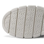 Close-up of the white rubber outsole showing the deep lugged tread pattern