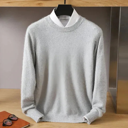 Side angle of a burgundy knitted jumper showing the ribbed hem and relaxed fit