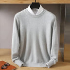 Side angle of a burgundy knitted jumper showing the ribbed hem and relaxed fit