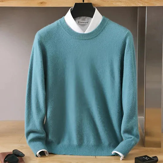 Detail of the ribbed hemline and side seam on a sky blue knitted jumper