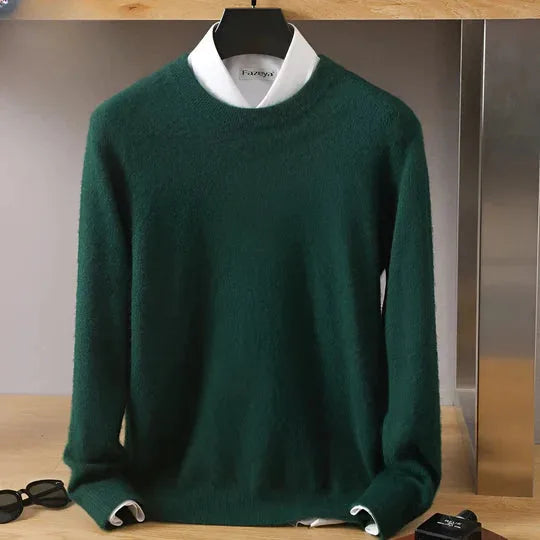 Dark green knitted jumper with mock neck layered over a white shirt collar, front view