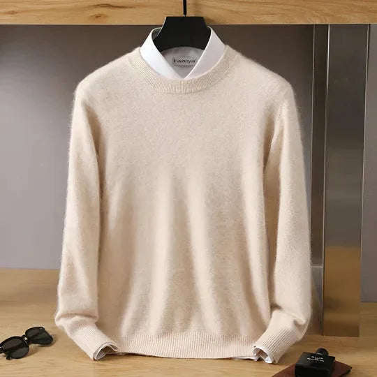 Beige knitted jumper with mock neck layered over a white shirt collar, hanging display
