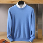 Sky blue knitted jumper with mock neck shown over a white shirt, front hanging view