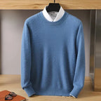 Close-up of the ribbed cuff and knit texture on a grey jumper sleeve