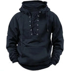 Black hoodie close-up showing the eyelet lacing, drawstrings and ribbed hem