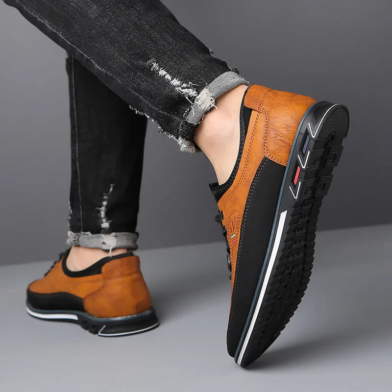 Man wearing camel brown leather shoes with ripped jeans, close-up rear and side view