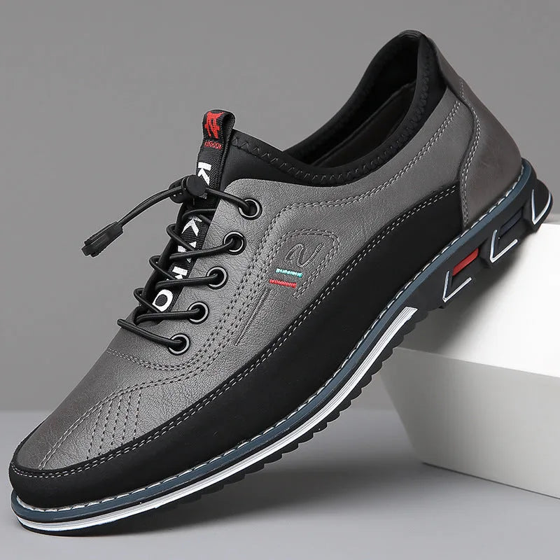 Charcoal grey leather shoe with black suede heel panel and contrast white midsole stripe