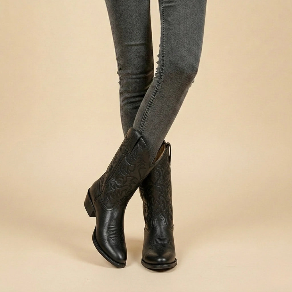Top-down view into the black leather boot shaft revealing the lined interior and collar shape