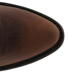 Close-up of the brown leather pointed toe cap with decorative stitched detailing