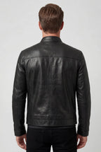 Rear view of the black leather jacket showing the clean back seam and tailored fit
