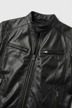 Close-up of the black leather jacket collar, snap button neck and two zip chest pockets