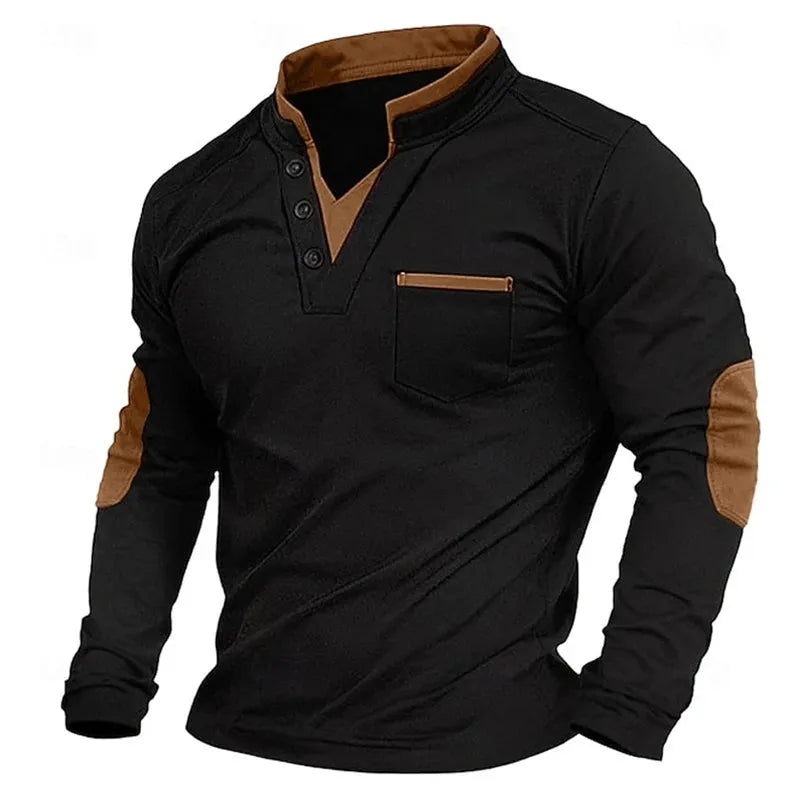 Black long-sleeve polo shirt with tan contrast collar, button placket and elbow patches, worn open at the neck
