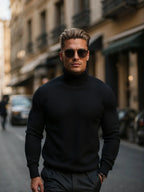 Front view of the black polo neck jumper highlighting the smooth knit texture and fitted silhouette