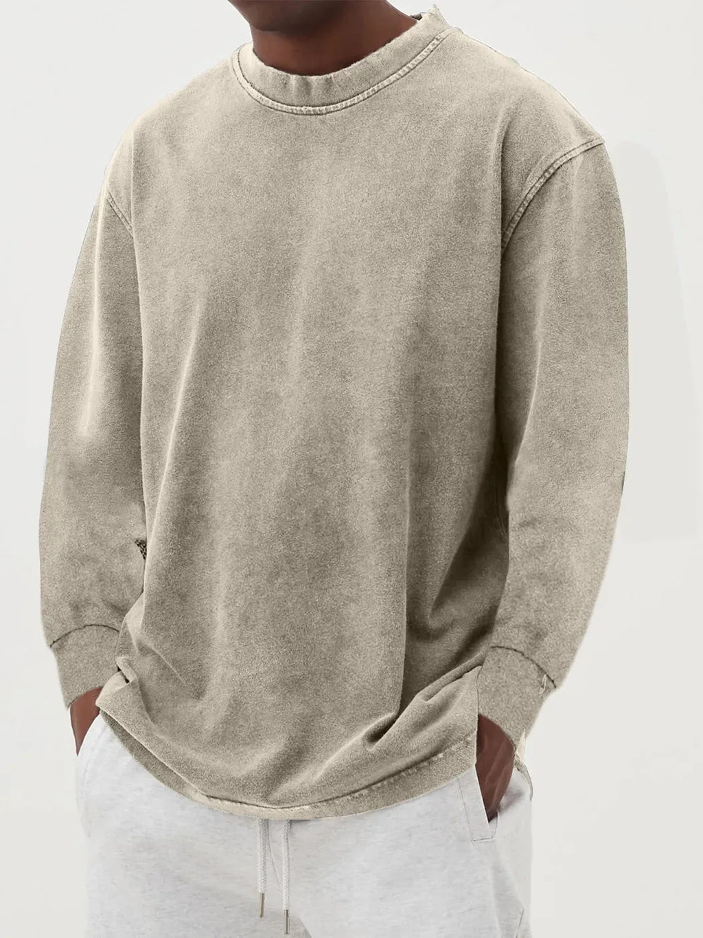 Pink washed oversized jumper photographed close up to show the soft worn-in cotton texture