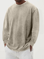 Pink washed oversized jumper photographed close up to show the soft worn-in cotton texture