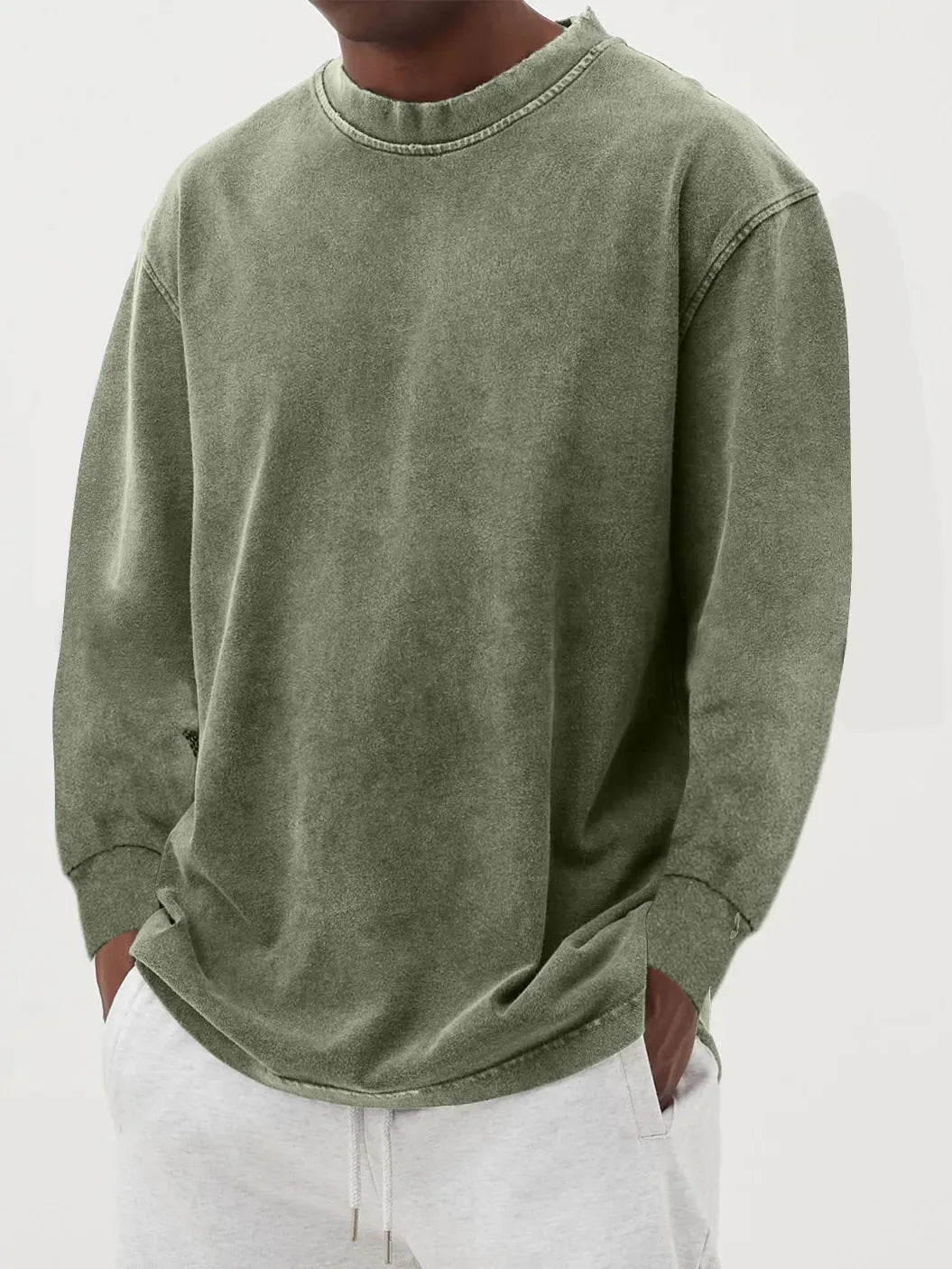 Brown washed jumper close-up showing the rolled neckline stitching and long sleeve construction