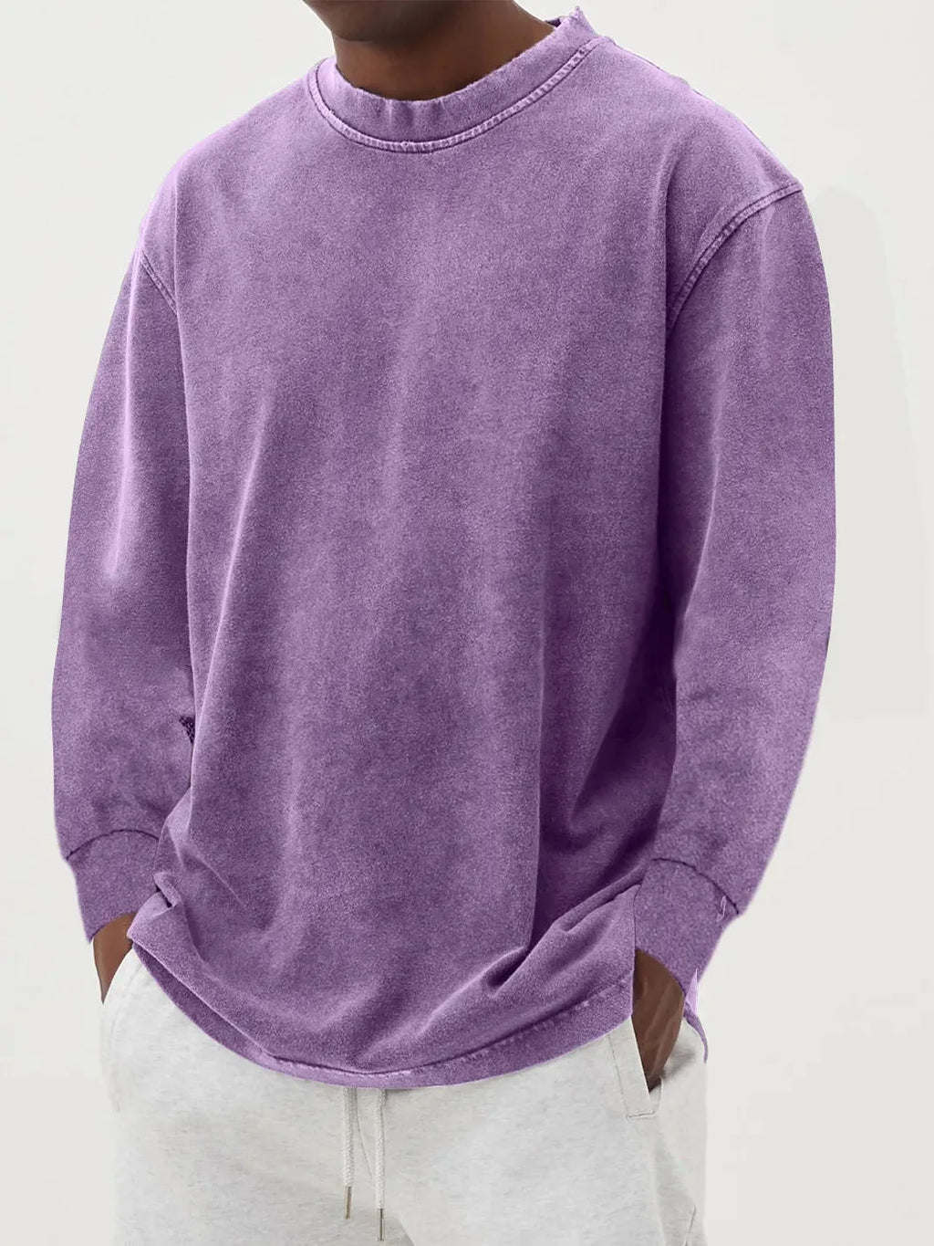Black washed oversized jumper paired with light grey joggers, showing the full relaxed fit from the front