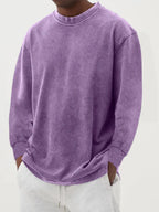 Black washed oversized jumper paired with light grey joggers, showing the full relaxed fit from the front