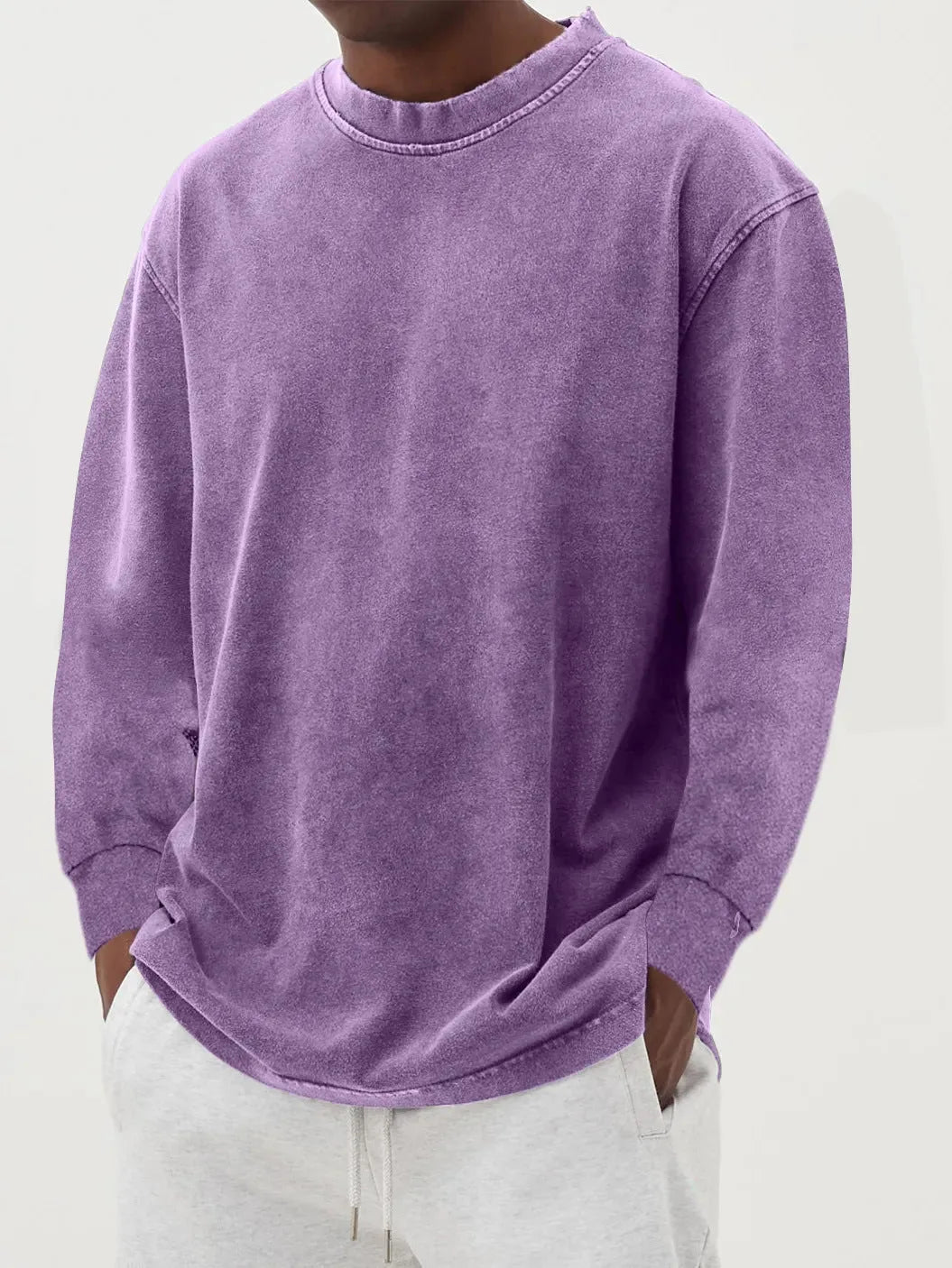Black washed oversized jumper paired with light grey joggers, showing the full relaxed fit from the front