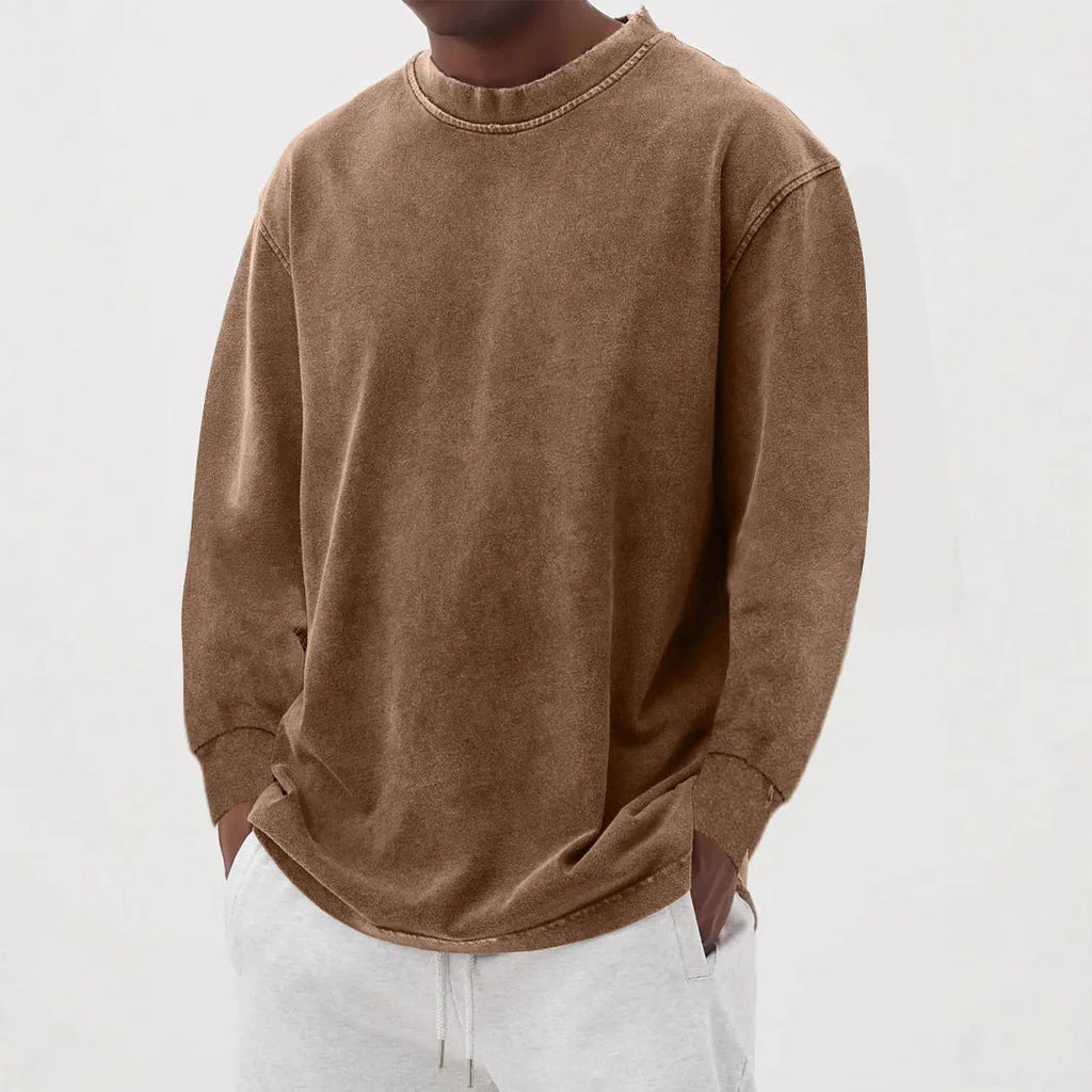 Brown washed oversized jumper with long sleeves and ribbed cuffs, shown on a male model from the front