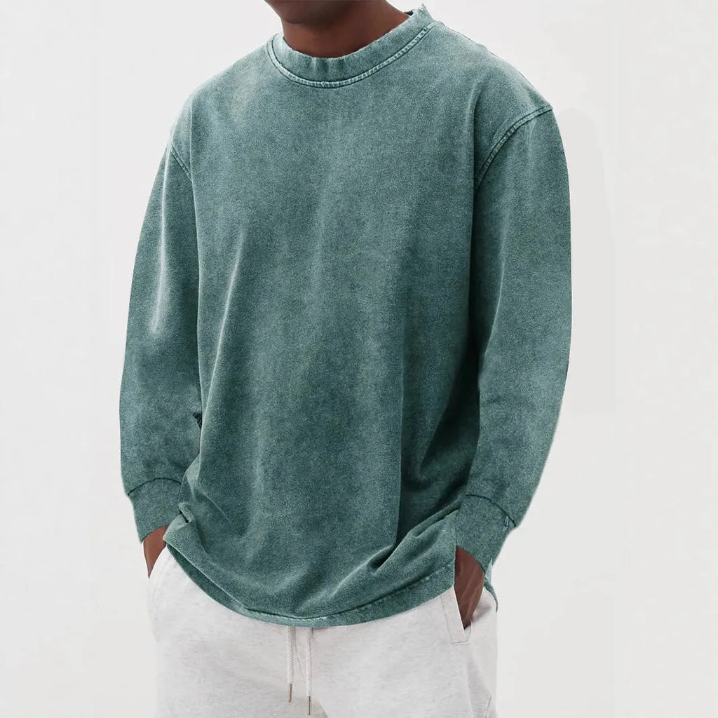 Sage green washed knit jumper with a relaxed, oversized fit and raw-edge crew neckline