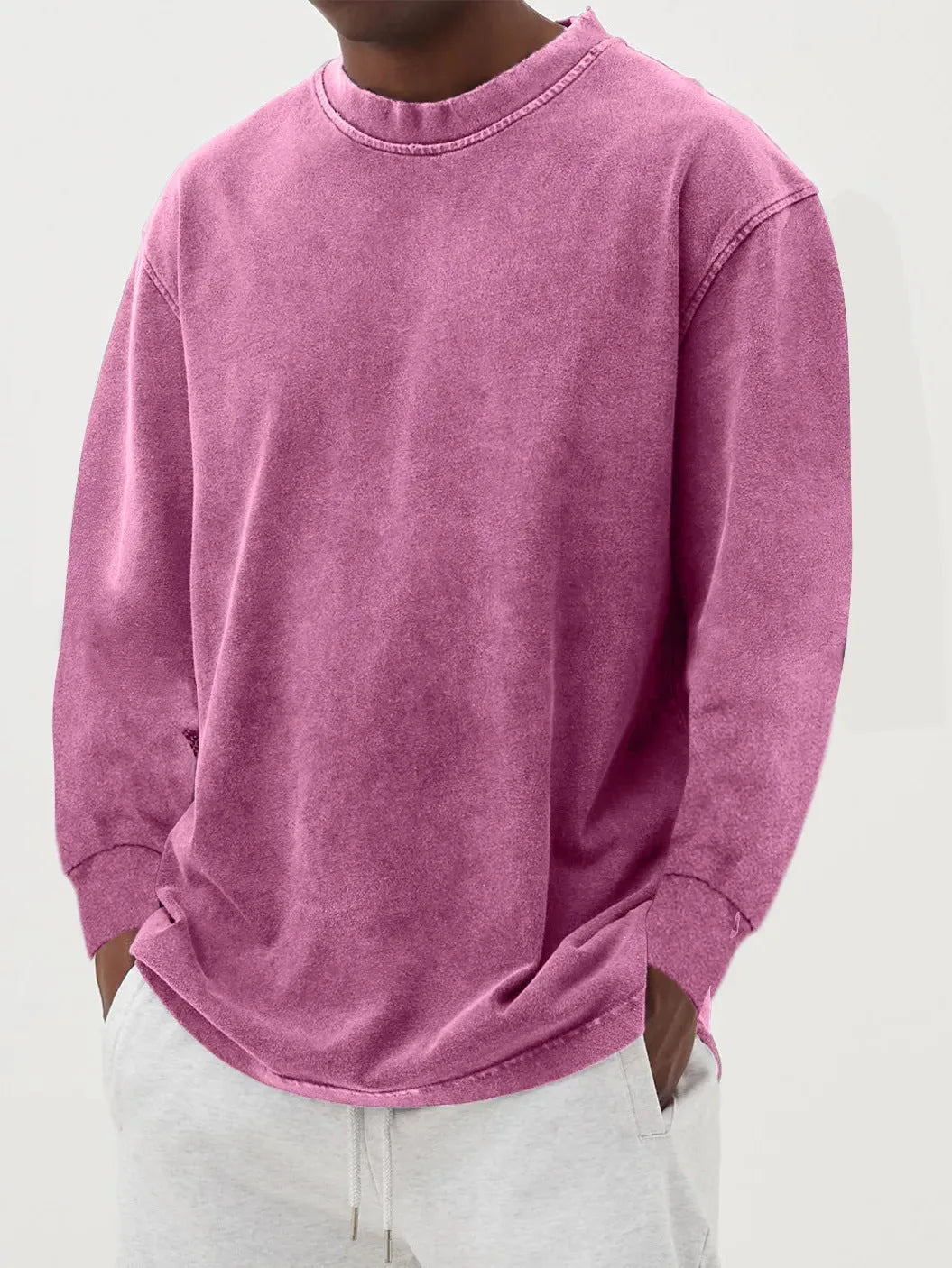Close-up front view of a magenta pink washed knit jumper showing the soft brushed fabric texture