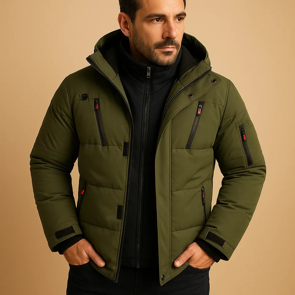 Olive green puffer jacket with hood, zip pockets and ribbed cuffs, worn with a black polo neck jumper.