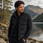 Back view of a black padded gilet showing the smooth quilted panelling across the shoulders