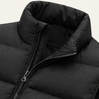 Back view of an army green padded gilet showing even horizontal quilting and stand collar