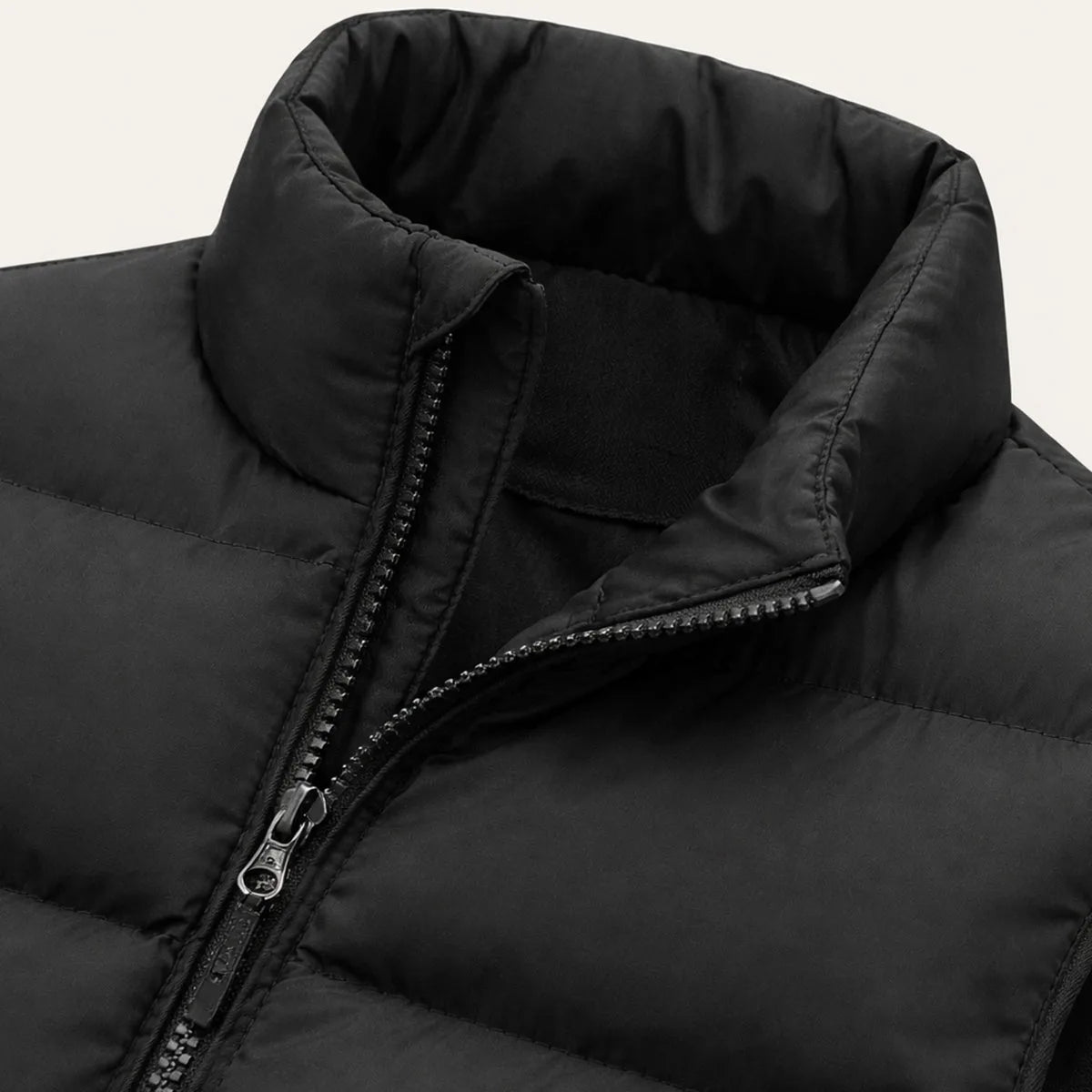 Back view of an army green padded gilet showing even horizontal quilting and stand collar