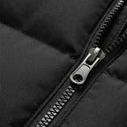Detail of the zipped side pocket and quilted stitching on a navy blue padded gilet