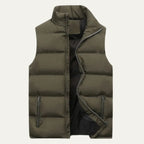 Front view of an army green quilted gilet, unzipped, with stand collar and zipped side pockets
