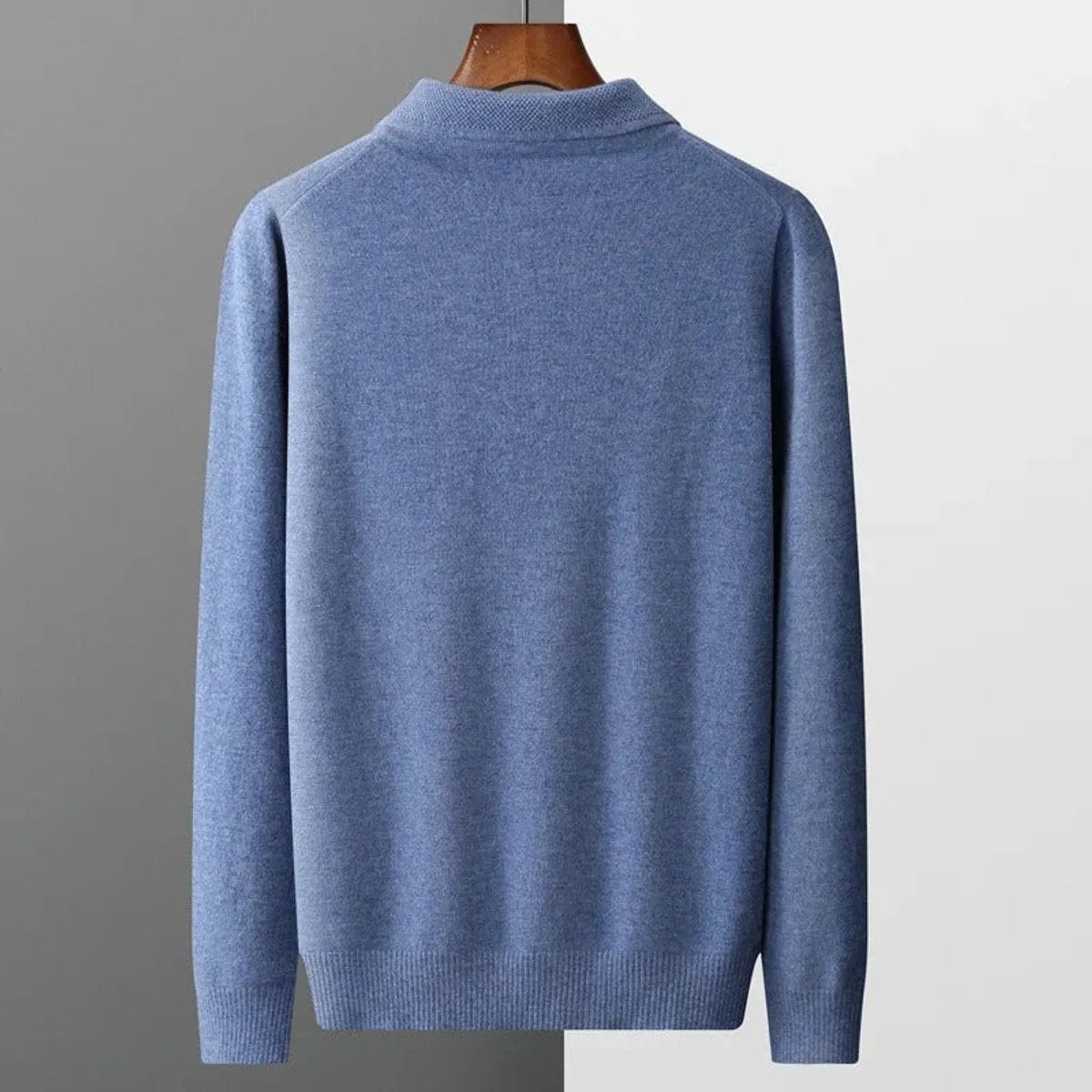 Front view of the grey polo jumper folded flat showing even ribbing on collar and cuffs