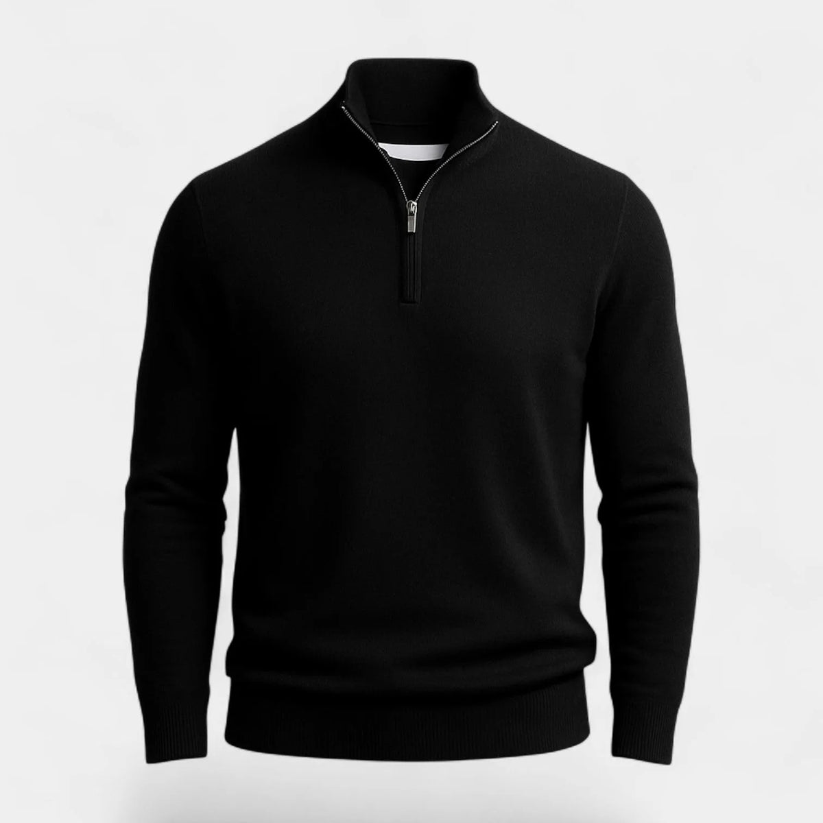 Close-up flat view of a black quarter-zip jumper showing the ribbed collar, metal zip pull and knit texture