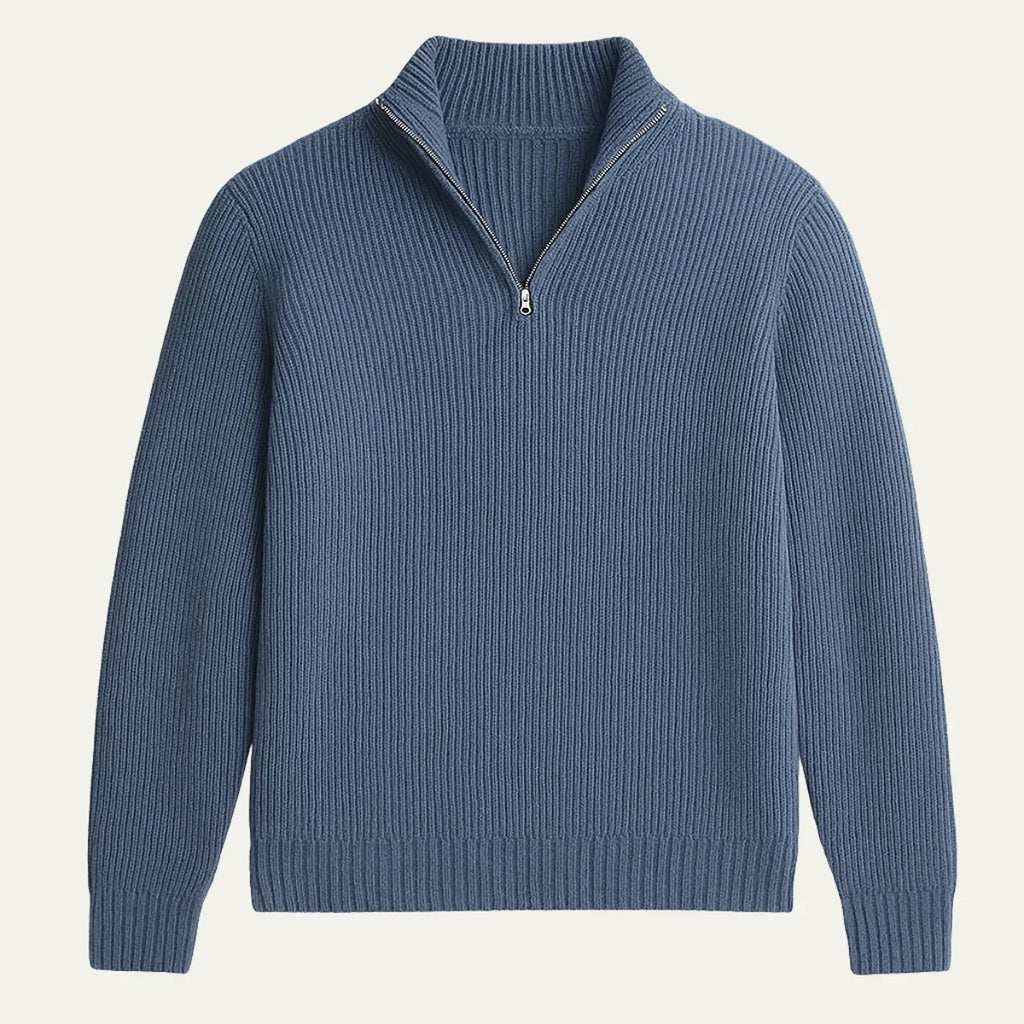 Navy blue ribbed knit half-zip jumper laid flat, showing silver zip pull and classic collar