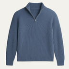 Navy blue ribbed knit half-zip jumper laid flat, showing silver zip pull and classic collar