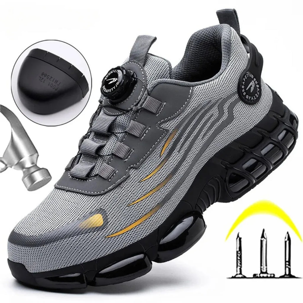 Grey mesh safety trainer with reinforced toe cap inset, rotary dial lacing, hammer icon and anti-puncture sole graphic