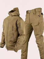 Beige hooded softshell jacket and matching cargo trousers with belt, laid out to show fabric texture