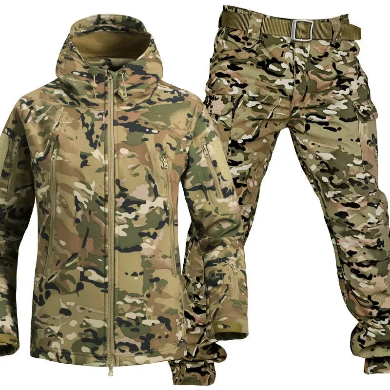 Camouflage print softshell jacket with hood and matching cargo trousers featuring multiple zip pockets and belt