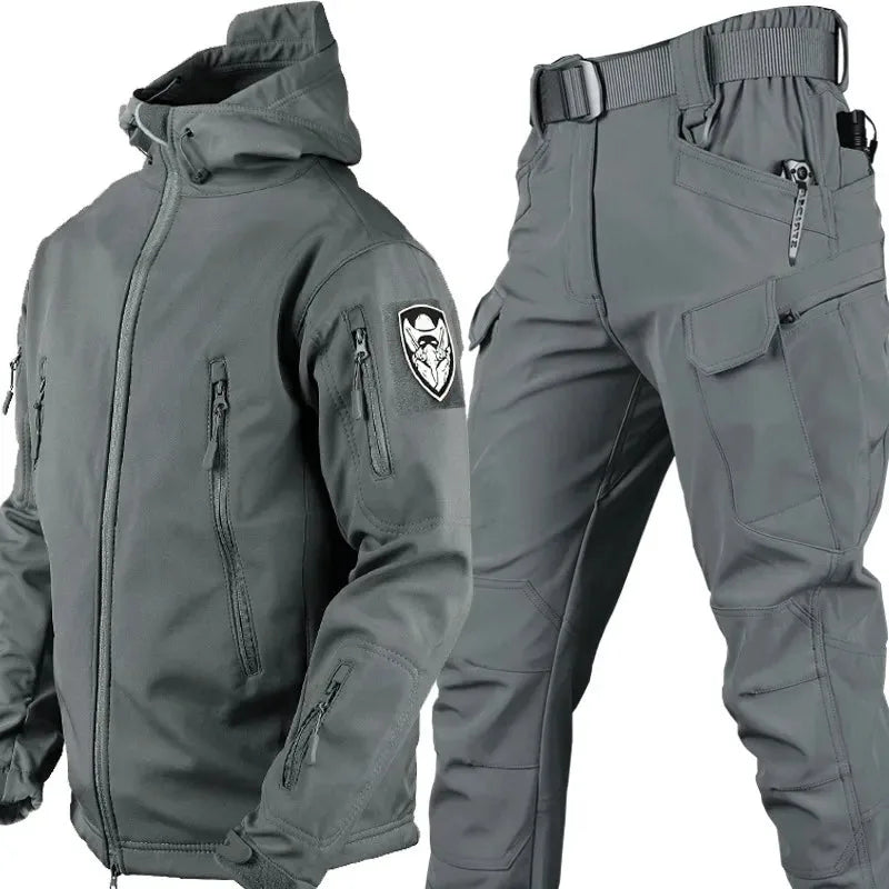 Grey softshell hooded jacket and cargo trousers set, shown with zip chest pockets and cargo leg pockets