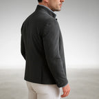 Back view of a grey mandarin collar jacket highlighting the centre seam and structured shoulders