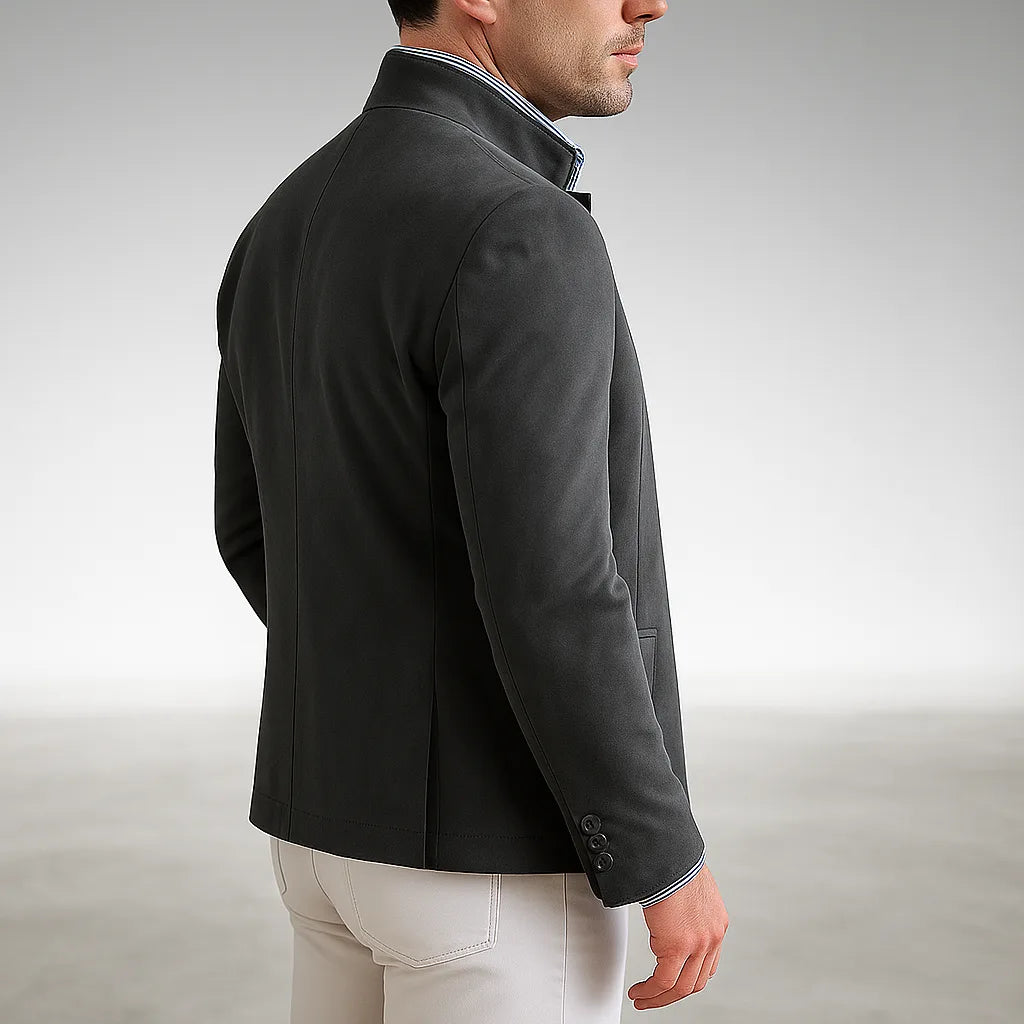 Back view of a grey mandarin collar jacket highlighting the centre seam and structured shoulders