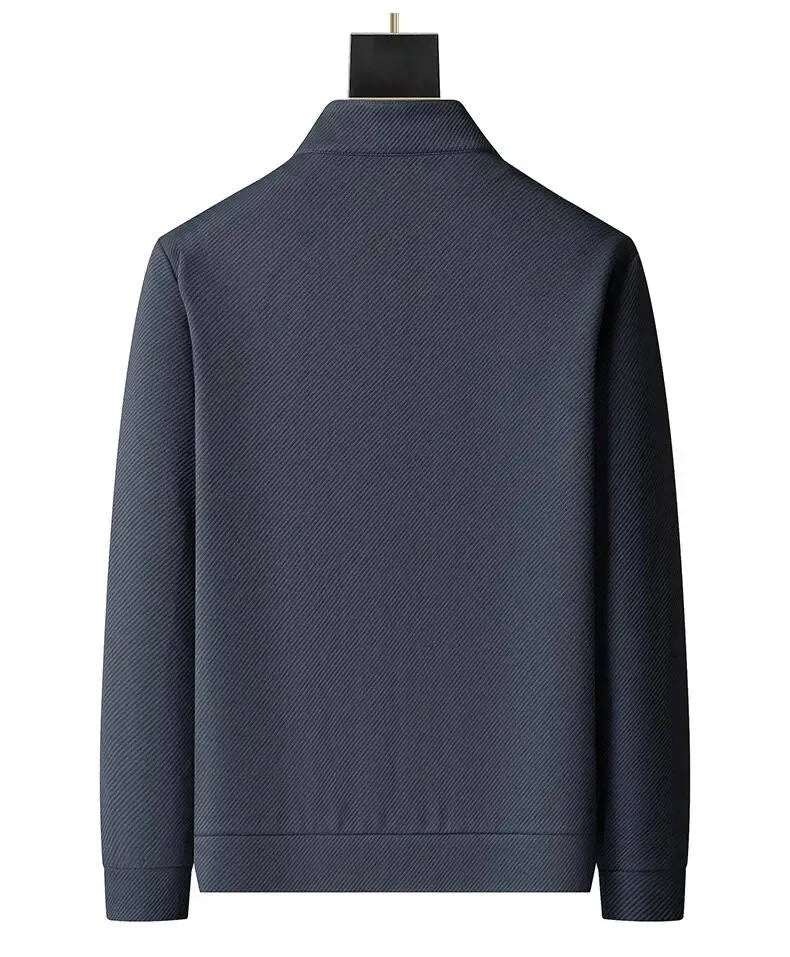 Back view of grey textured zip-up jacket showing stand collar and ribbed cuffs on plain background