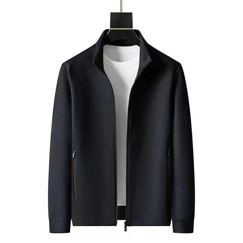 Front view of black textured zip-up jacket with stand collar worn open over a white t-shirt